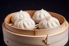 pngtree-three-steamed-dumplings-are-in-bamboo-containers-image_10203445.jpg